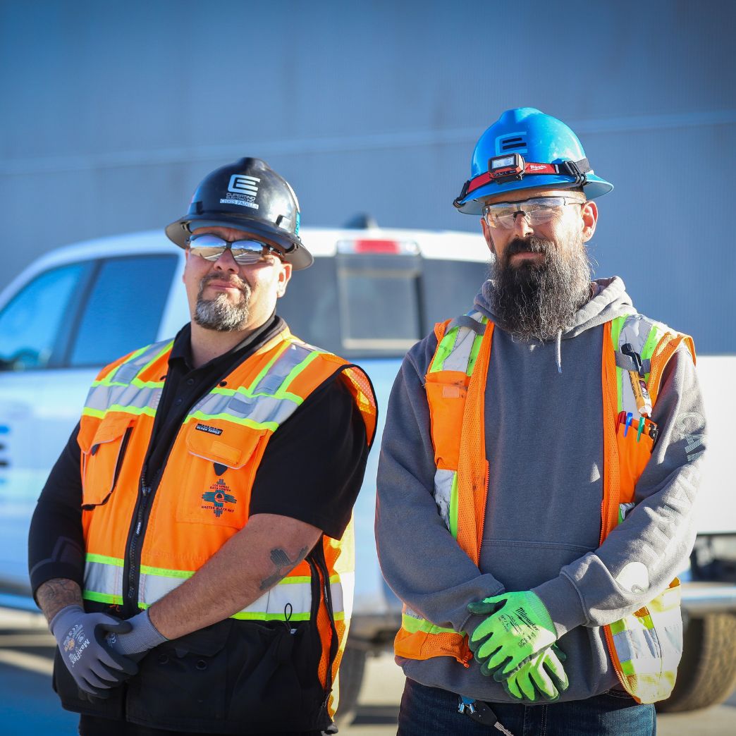 Two CEI workers taking a photo together