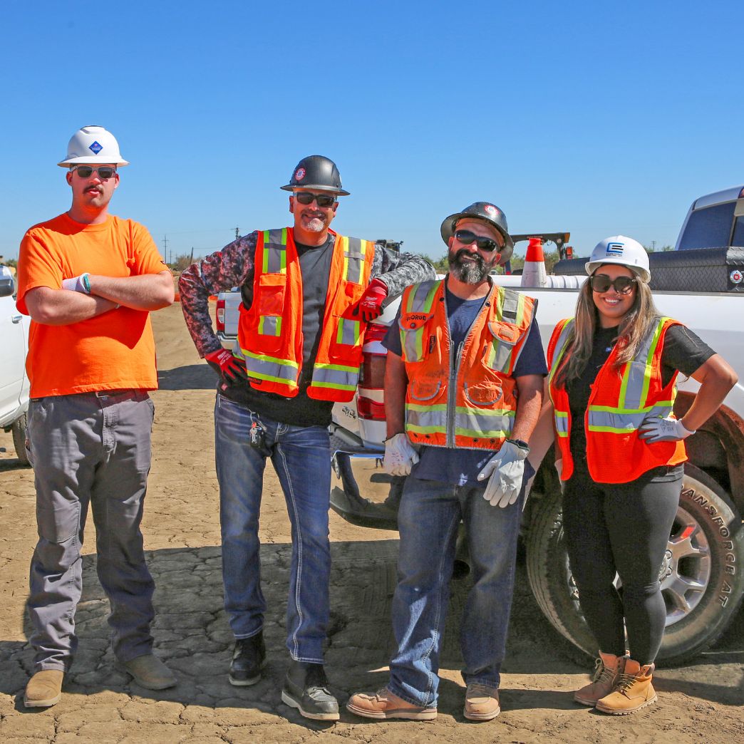 CEI workers at a job site posing for a photo