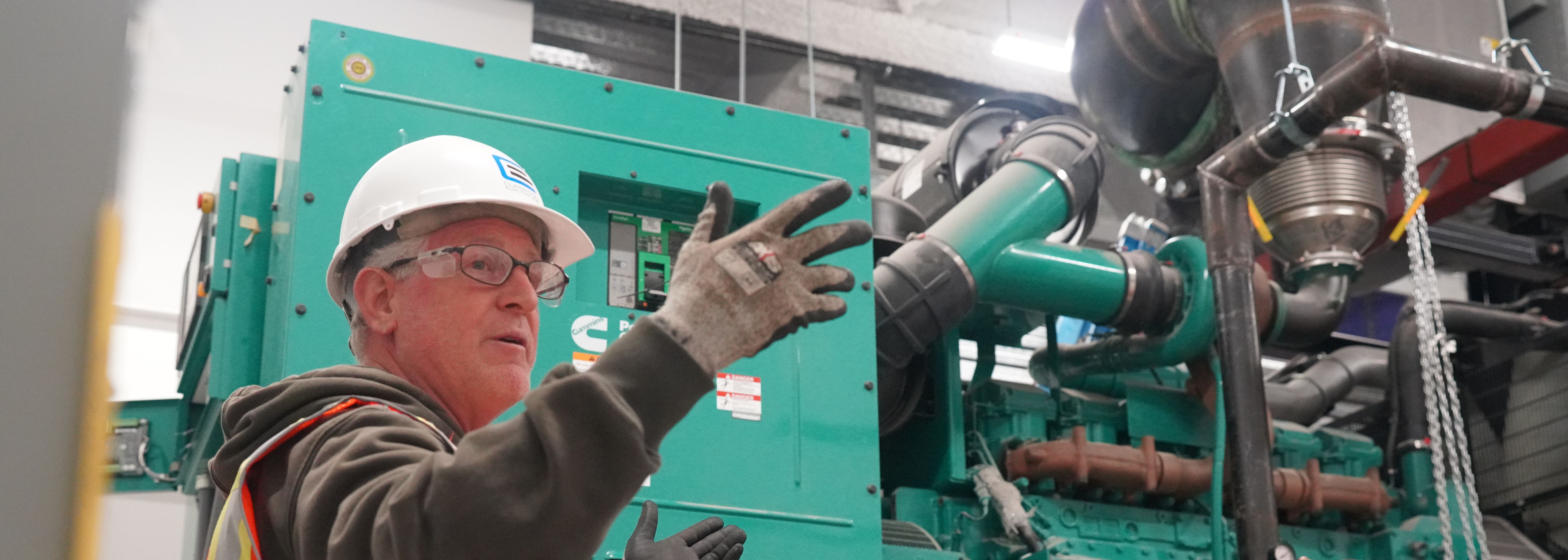 CEI foreman explaining the generator